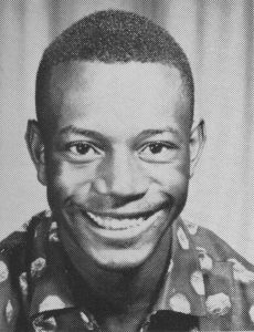 Joe McWilliams smiling in his Dunbar High School yearbook portrait from the early 1960s.