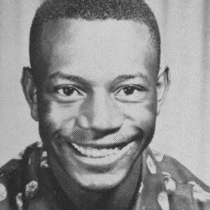 Joe McWilliams smiling in his Dunbar High School yearbook portrait from the early 1960s.