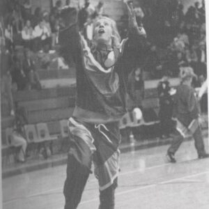 Kim Sumrall goes up for a layup in front of a packed gym crowd during a 1990s game