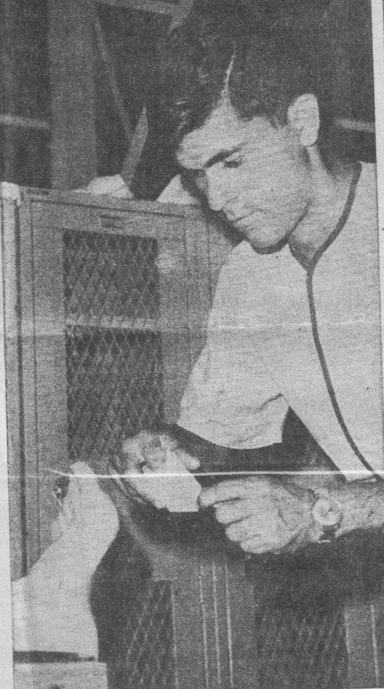 Robert “Prof” Ramos as a high school student trainer working on an athlete's ankle beside a locker, from a newspaper clipping