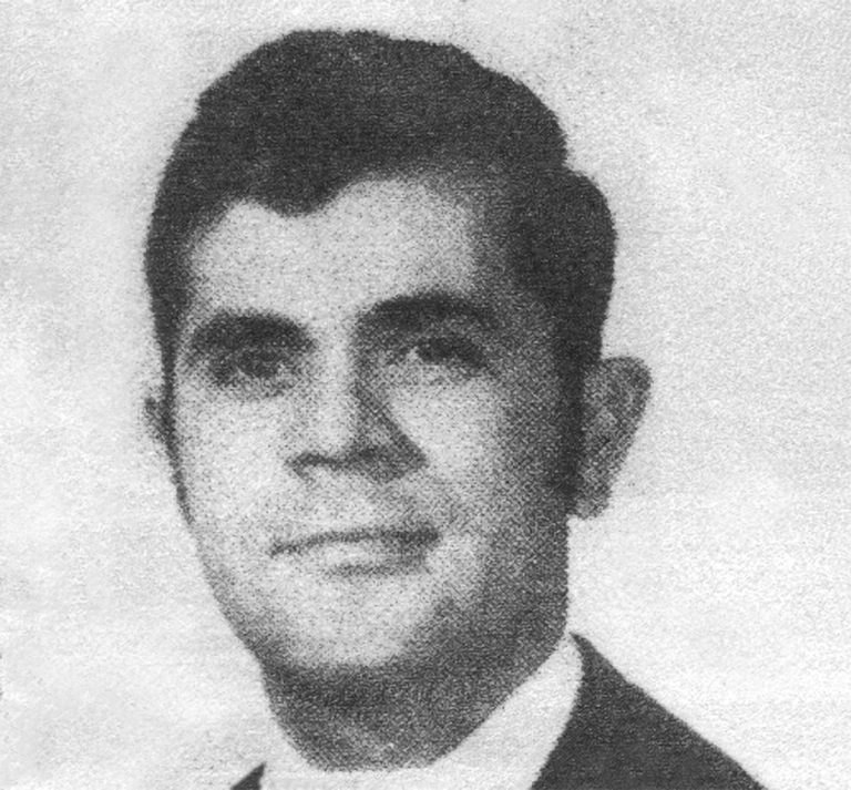 A young Robert Ramos in a suit and tie in a newspaper photo from early in his athletic training career.