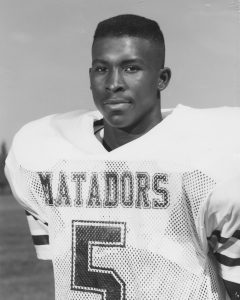 Taje Allen in his white Estacado Matadors No. 5 football jersey in the early 1990s.