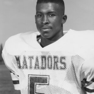 Taje Allen in his white Estacado Matadors No. 5 football jersey in the early 1990s.
