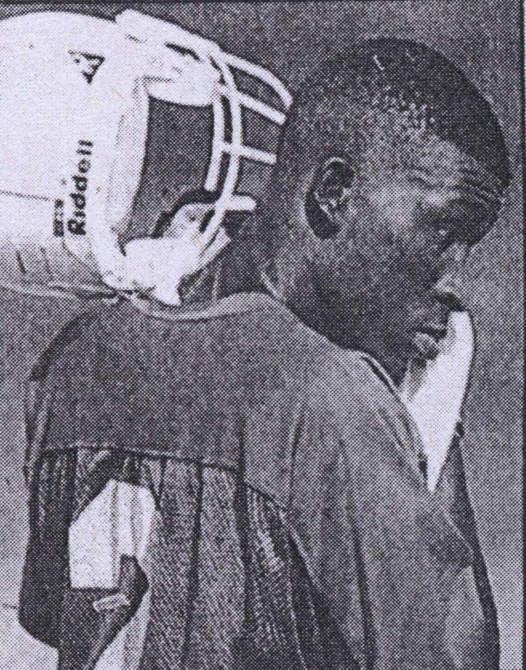 Taje Allen in profile with his Riddell helmet pushed back at a Texas Longhorns practice.