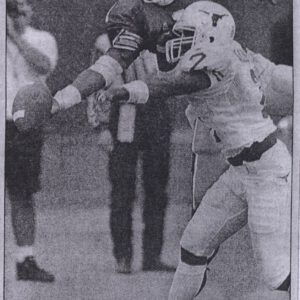 Newspaper photo of Taje Allen breaking up a two-point conversion pass for the Texas Longhorns against Pittsburgh.