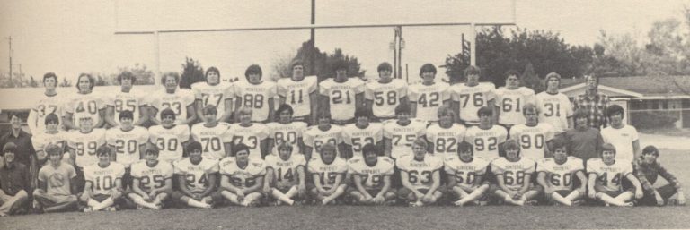 Monterey football team posed in three rows on the field in a wide black-and-white photo from the Tim Leslie collection