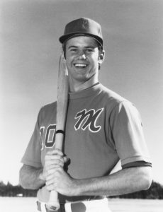 Tim Leslie smiles with a bat over his shoulder in his Monterey No. 10 baseball uniform in the 1970s.